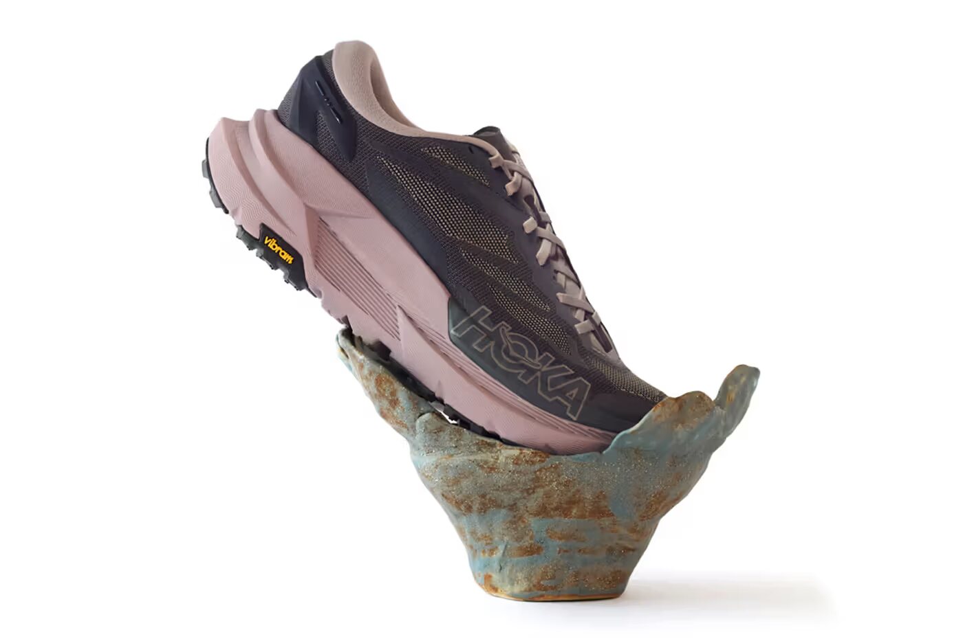 J.L-A.L x HOKA Mafate X campaign image, shoe on ceramic pedestal